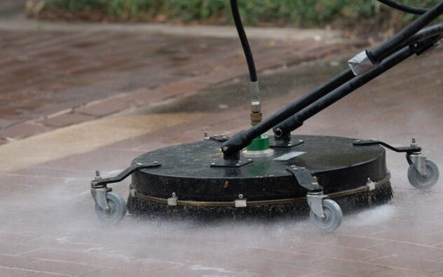Pressure washing using flat surface cleaner